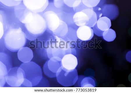 Abstract Purple, lilac circular bokeh background, beautiful background on dark.  Blurred lights, bokeh effect.  Blue lights background