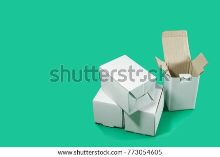 White boxes on green background in shopping concept.