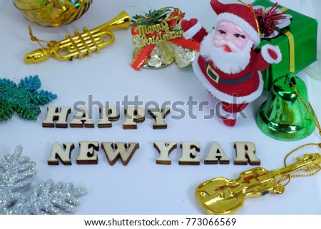Merry Chrismas background which in side picture show Santa Claus doll ,gold bell , trumpet , guitar and the star with white background color.