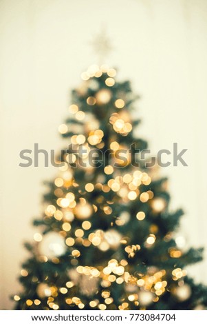 Christmas tree background with blurred, sparking, glowing. Happy New Year and Xmas theme. Toning