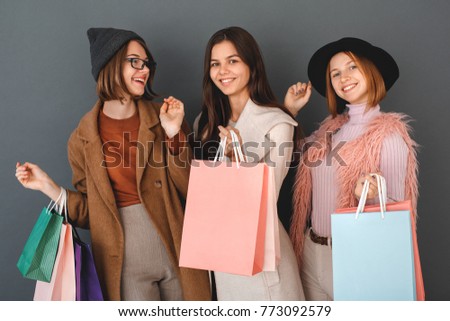 Young girls teenagers friends together shopping concept