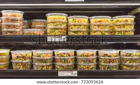 Fresh chopped and chunks Tex Mex salsa plastic box display in local store at Houston, Texas, US. Convenience, healthy lifestyle.