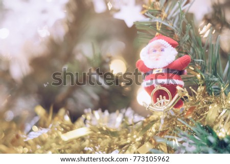 Christmas Santa Claus doll ornament  decorate on pine tree copy space blur background for Xmas New Year festival.
