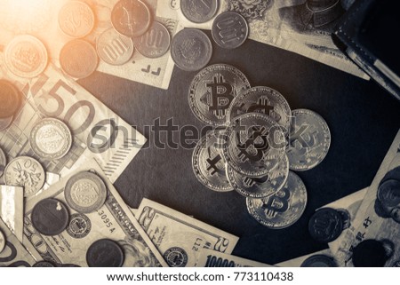 golden bitcoin coin on internation mpny bill with wallet on brown leather background business ideads concept