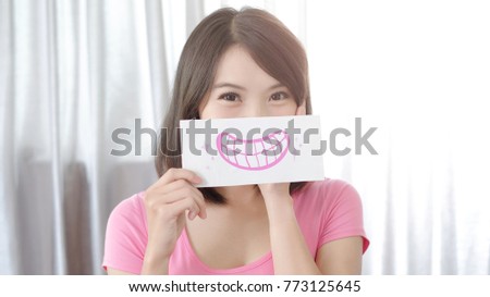 woman take smile happily tooth card in the home
