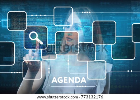 The concept of business, technology, the Internet and the network. A young entrepreneur working on a virtual screen of the future and sees the inscription: Agenda