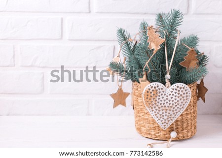 Christmas  toys, heart  and branches  fur tree on  white wooden background. Decorative christmas composition. Selective focus. Place for text.