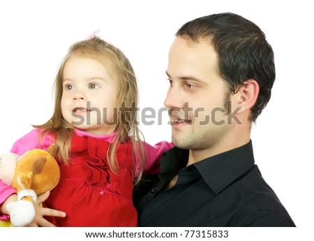 Portrait of happy father and his adorable little daughter on the white background