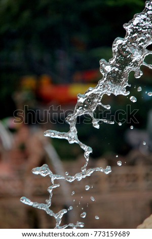 Water splashing fast shutter speed freeze effect
