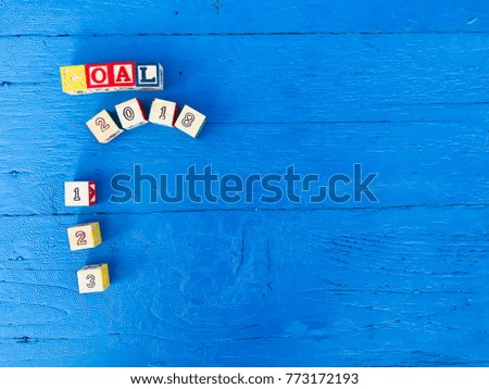 The word Goals 2018 wooden fonts on the blue wooden background, multi color fonts