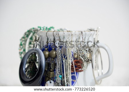 Earrings collection on the cup. Slovakia