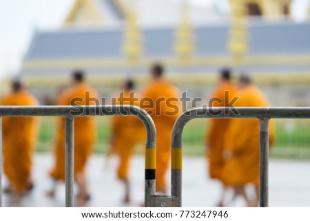 blurred picture of buddhist monks walking at The Royal Crematorium for King Bhumibol Adulyadej
