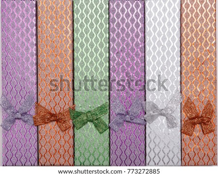 Background of colored gift boxes with bows
