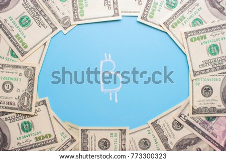 invest in bitcoin concept. dollars and bitcoin on blue background