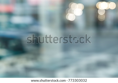 LIGHT REFLECTIONS OF THE CITY STREET IN THE SHOP WINDOW Royalty-Free Stock Photo #773303032