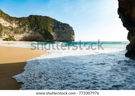 Enjoy the summer. Panorama view of a summer beach with beautiful rocks nearby