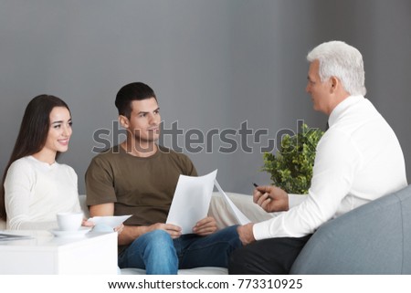 Young couple meeting with consultant in office