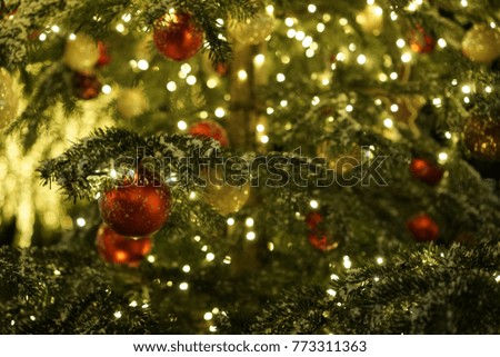 Red and gold decorations on Christmas tree