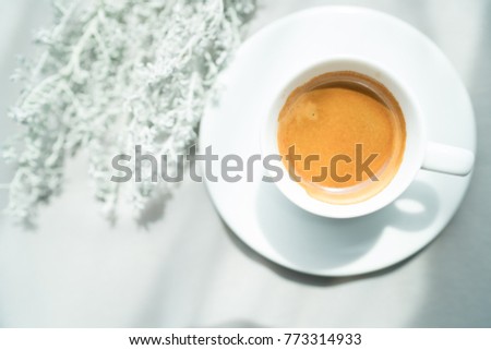 espresso coffee and white flower in morning