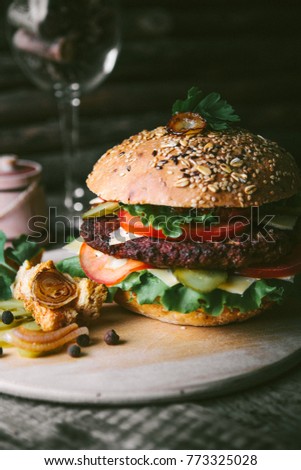 hamburger on a wooden table Royalty-Free Stock Photo #773325028