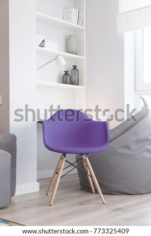 Interior of the room in light colors and a chair in color of the year 2018 pantone ultra violet  Royalty-Free Stock Photo #773325409