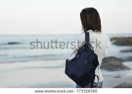 backside backpack Stand Wait alone Asian women look sea Hua Hin Thailand