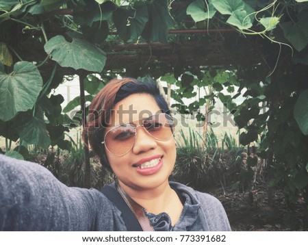 Woman taking a selfie in the garden