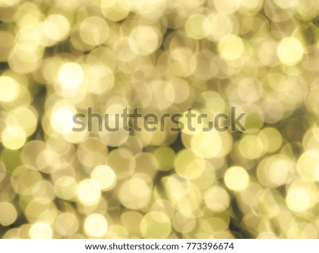 Blurred photo of  bokeh background of defocused glittering lights.