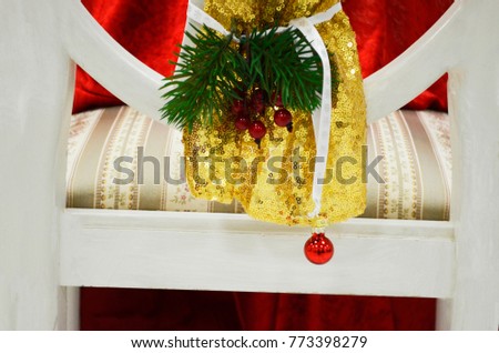 Christmas decoration on the back of a chair
