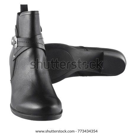 Black female leather boots with a zipper isolated on a white background