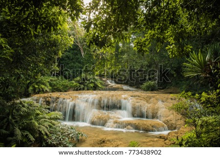 soft water of the stream in the natural park, Beautiful waterfall in rain forest ( Maekae Waterfall, Thailand)