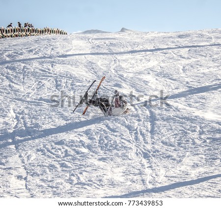 The fall of the skier in the snow