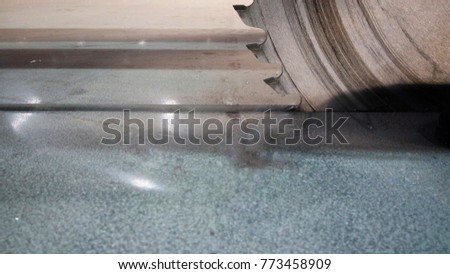 The metal cutting blade is very dangerous while working have a high rotation, Hazard work. This picture the cutting blade cut the aluminium you can see the aluminium powder. 