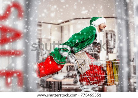 Man in shop interior and christmas sale time 