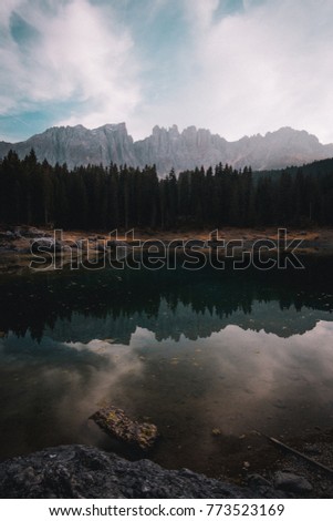 Lago di Carezza (Karersee) is one of the most beautiful alpine lakes. The dark green waters combine with the fascinating views of the Rosengarten and Latema Mountains. Autumn lake!