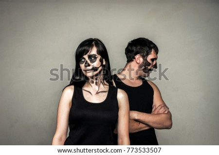 boy and girll posing in halloween style.Isolated studio portrait