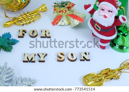 Merry Christmas Card "For my Son" letter , picture show Santa Claus doll,gold bell , trumpet , guitar and the star with white background color.