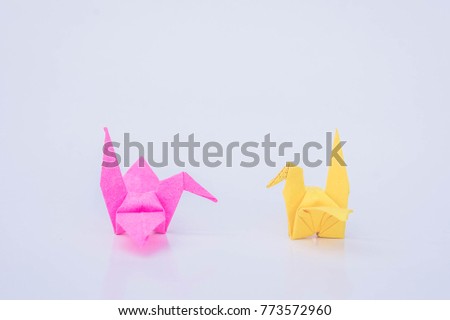 paper bird yellow and pink color paper on white background
