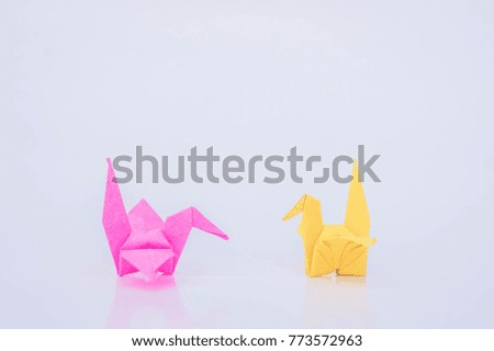 paper bird yellow and pink color paper on white background