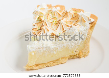 Slice of Lemon Pie isolated on white background