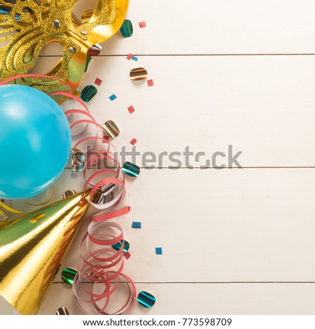 Colorful carnival on white wood background
