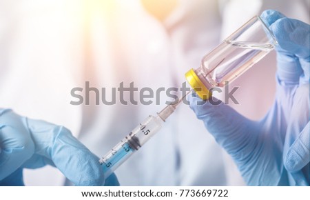 injecting injection vaccine medicine flu Royalty-Free Stock Photo #773669722