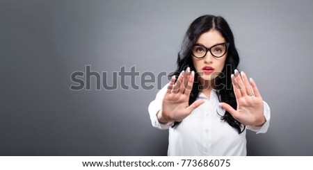Young woman making a rejection pose a solid background