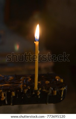 Lonely candle in the old Church