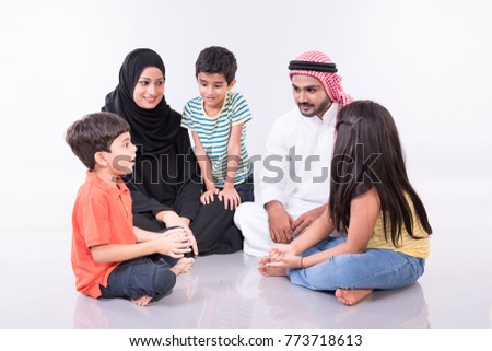 Arab family sitting at home with white background