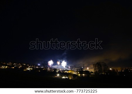 Firework over the small city suburb .