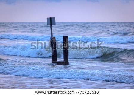 Beach at high tide Royalty-Free Stock Photo #773725618
