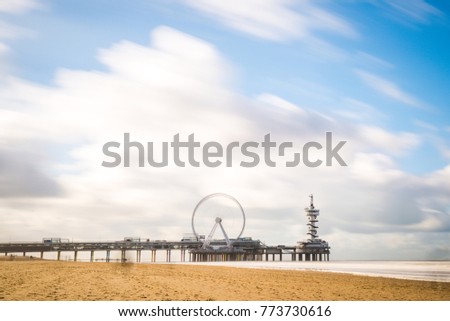 Scheveningen beach on a winter sunny day, Holland. Famous Pier in the background