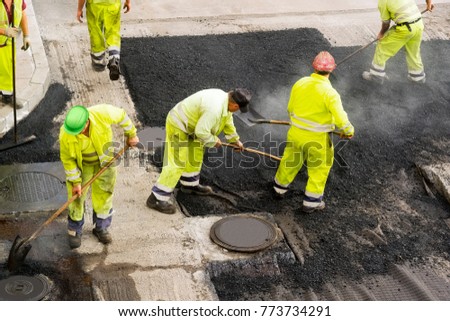 highway maintenance workers in construction site