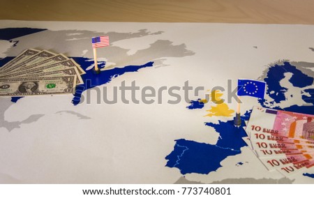 Dollar and euro,american and European flags over EU and US map,symbolizing the Transatlantic Trade and Investment Partnership or TTIP,with the aim of promoting trade and multilateral economic growth Royalty-Free Stock Photo #773740801